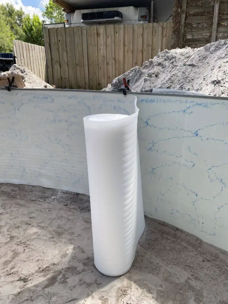 Wall foam applied to a resin above ground pool wall
