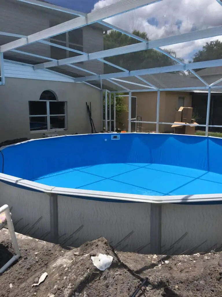above ground pool in a screen enclosure