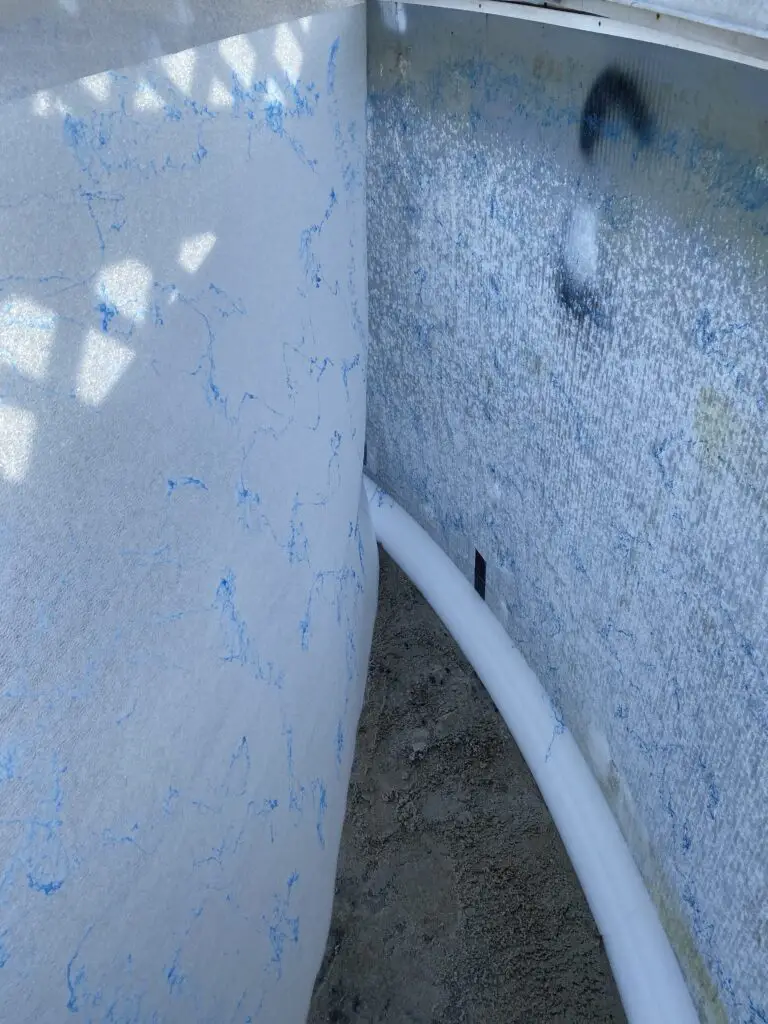 Wall foam for an above ground pool with glue and about to be applied