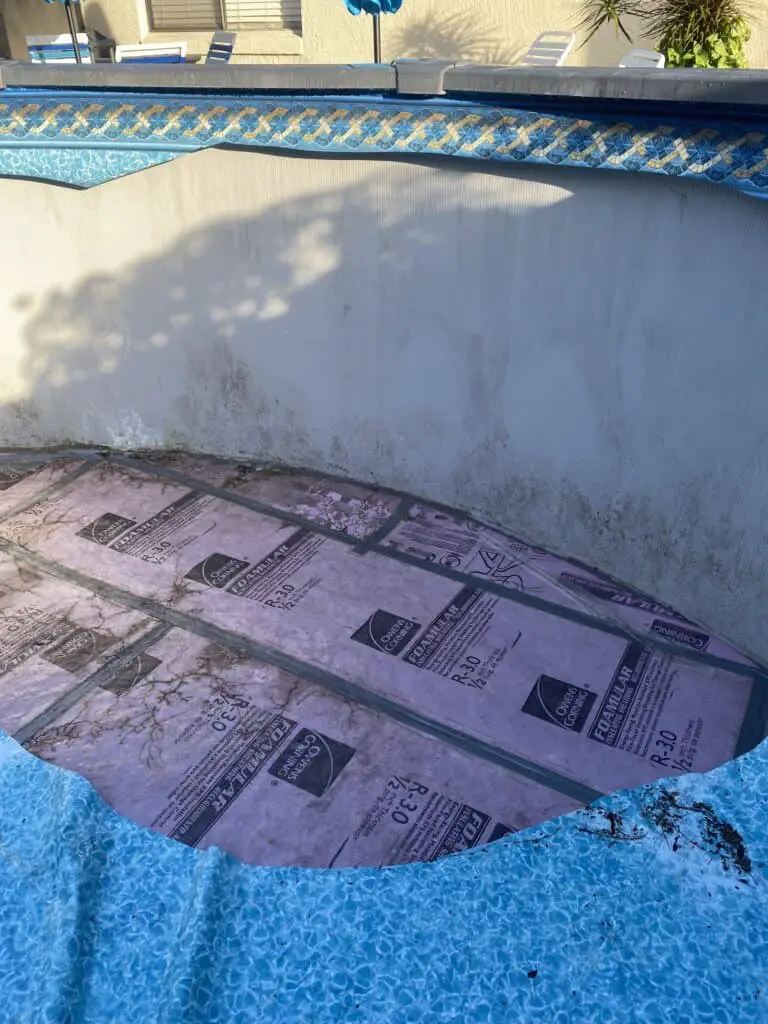 Foam sheeting taped together to make an above ground swimming pool bottom