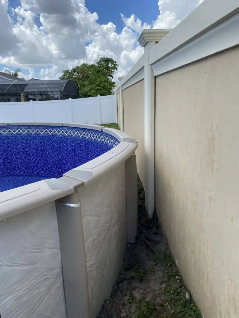 15' above ground pool next to a wall