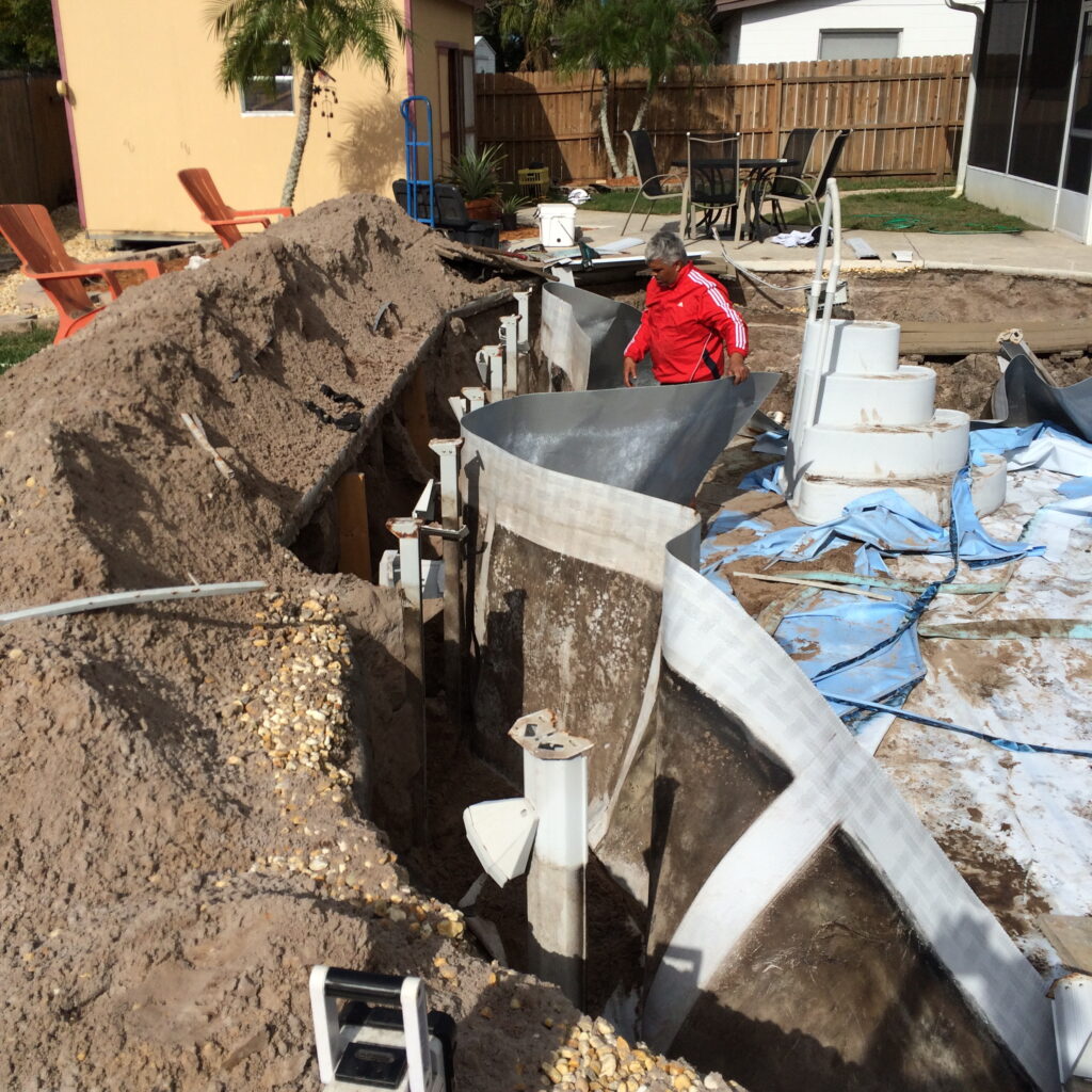 Collapsed oval above ground pool while attempting to change the liner in it.