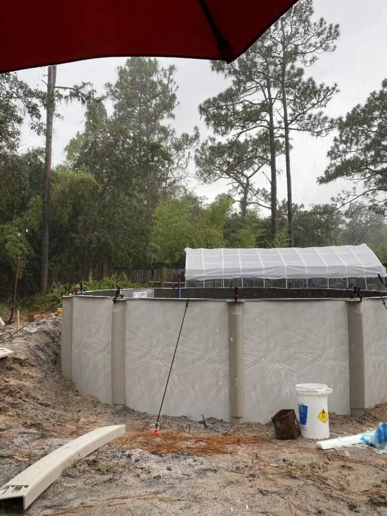 Bungee cords used to keep an above ground swimming pool up during installation