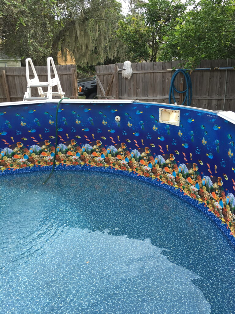 Above ground pool liner with a fish pattern on the sides