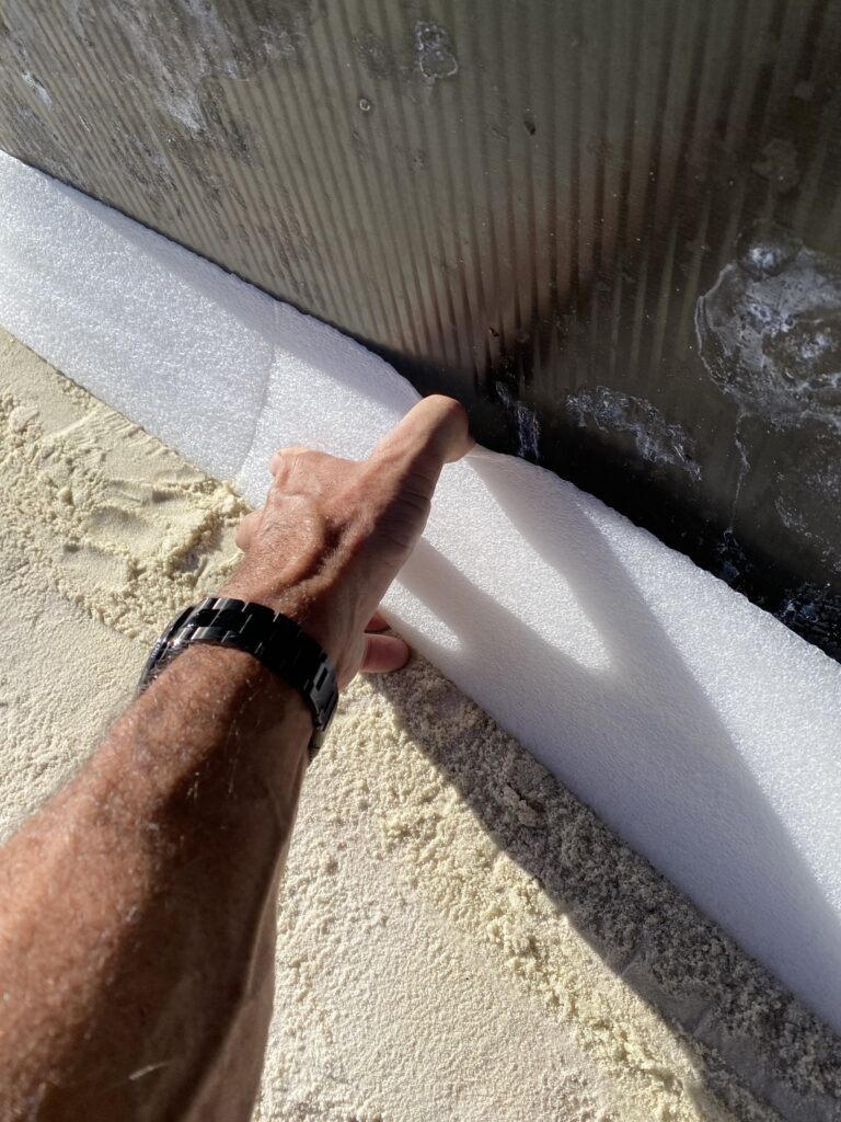 Foam coving being installed in an above ground swimming pool