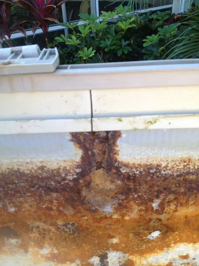 Badly rusted above ground pool wall caused by water entering from the bead receiver