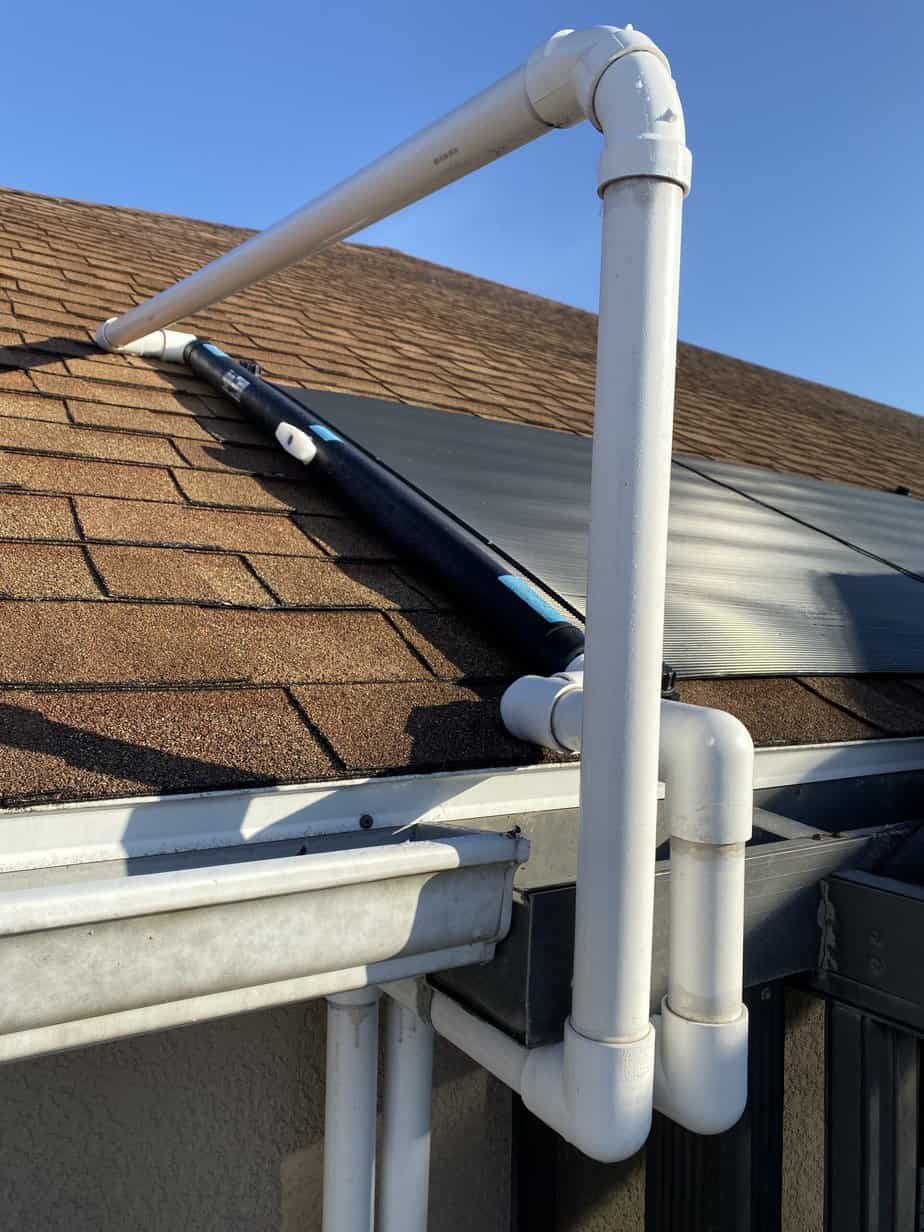 Solar panels set on roof and attached to an above ground swimming pool