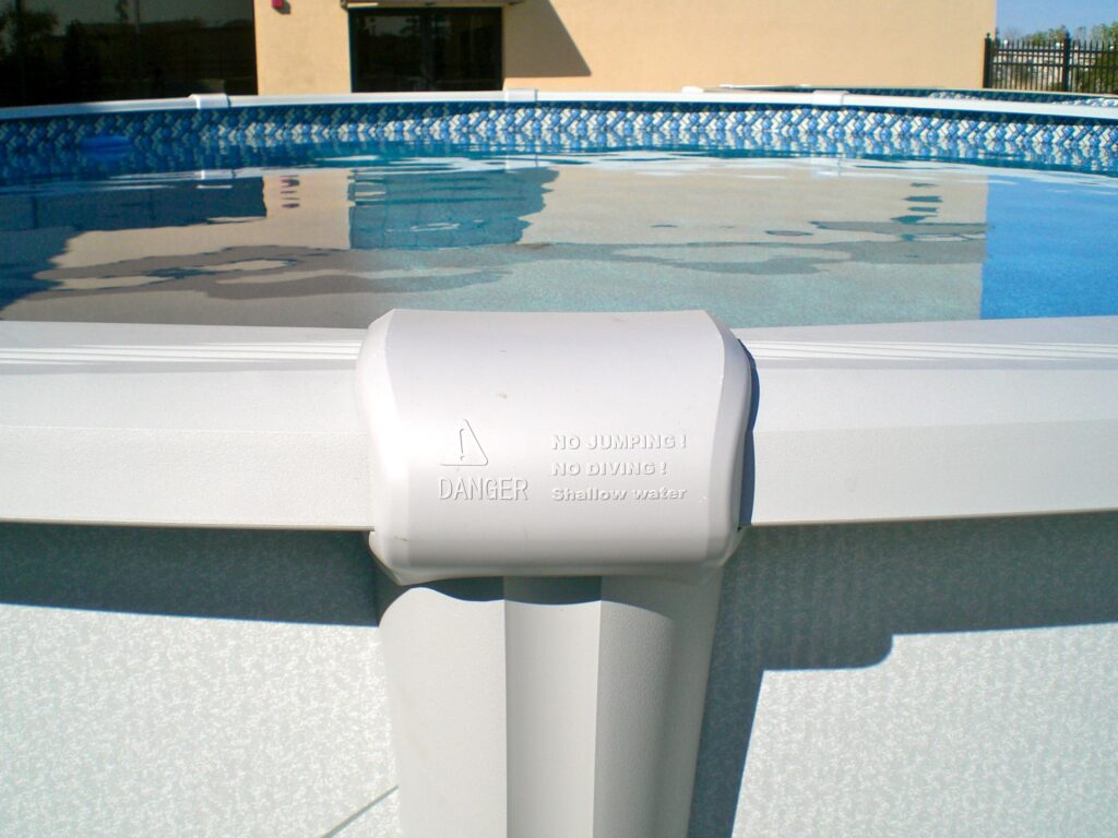 Above ground pool top rails and top cap that says "No Jumping"