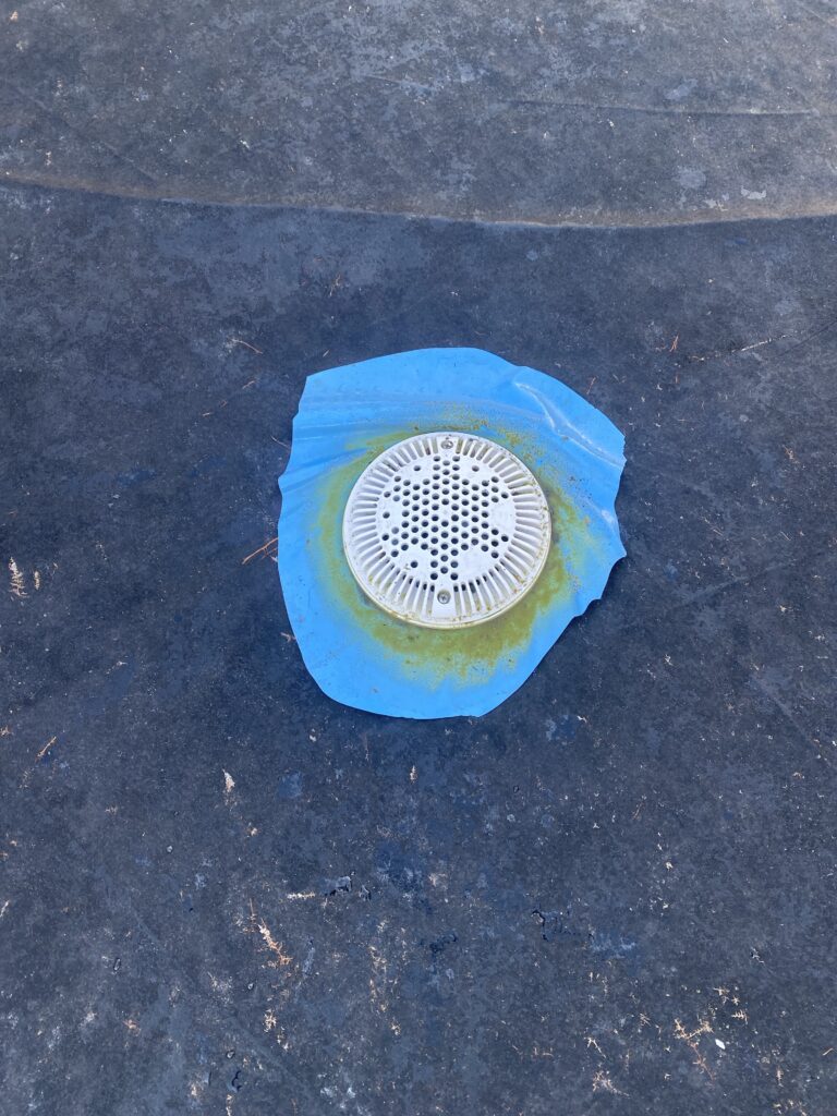 Piece of liner left around an above ground pool main drain